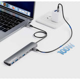 Manhattan USB-C Dock/Hub, Ports (x7): USB-A (x3) and USB-C (x4), with Power Delivery (PD) 100W- requires external USB-C charger (not included). USB powered (no external power supply required) when PD is not in use, Aluminium